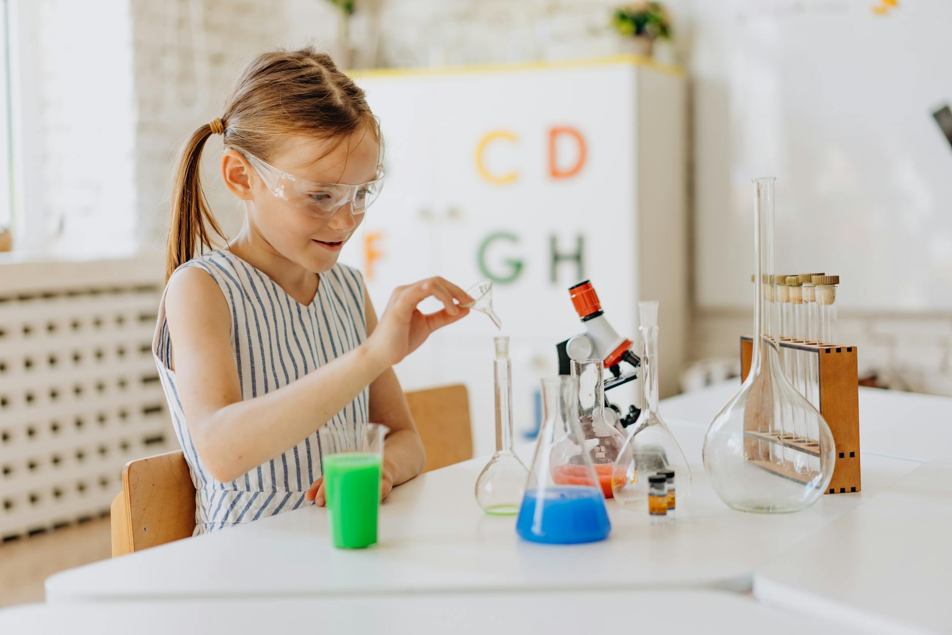 a girl doing a science experiment